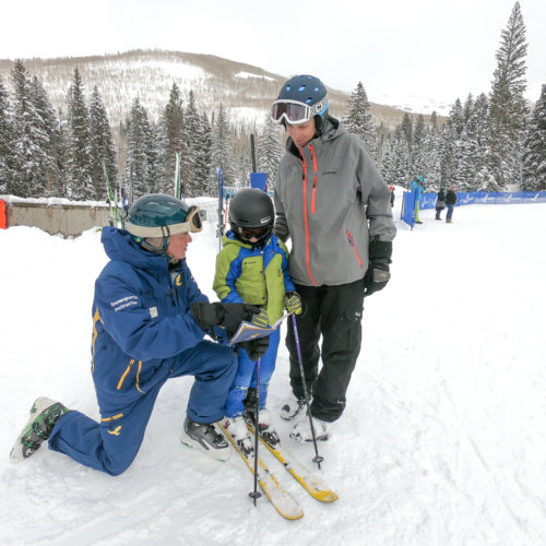 Ski & Ride School instructor with child and parent