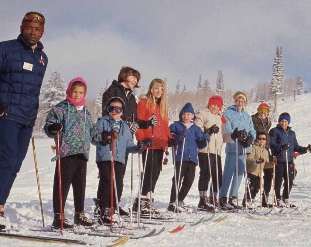 Black history month photo of Dr. Daily Oliver teaching a ski lesson