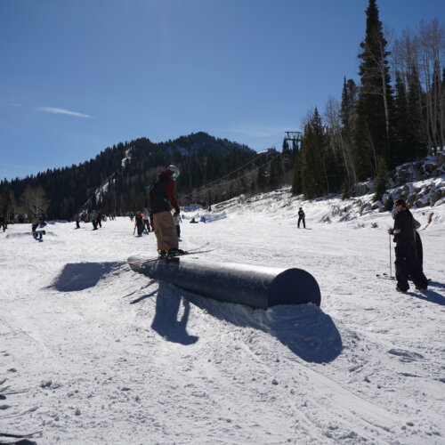 Skier grinding on a rail at Solitude Mountain Resort.