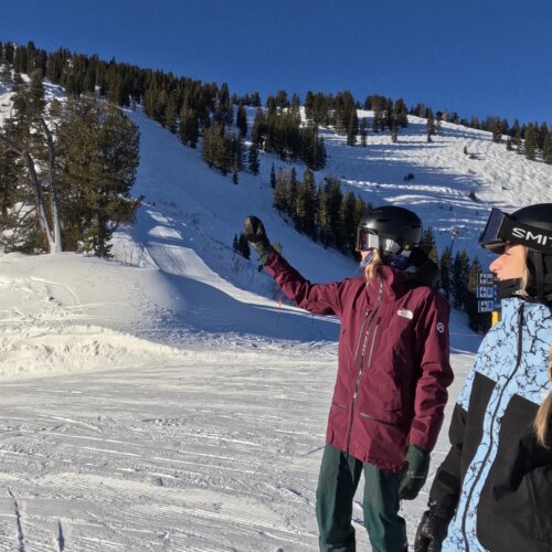 Two friends looking at what they are going to Ski at Solitude Mountain Resort.