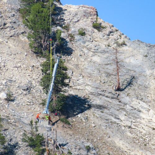 Solitude employees install an avalanche tower in Honeycomb Canyon