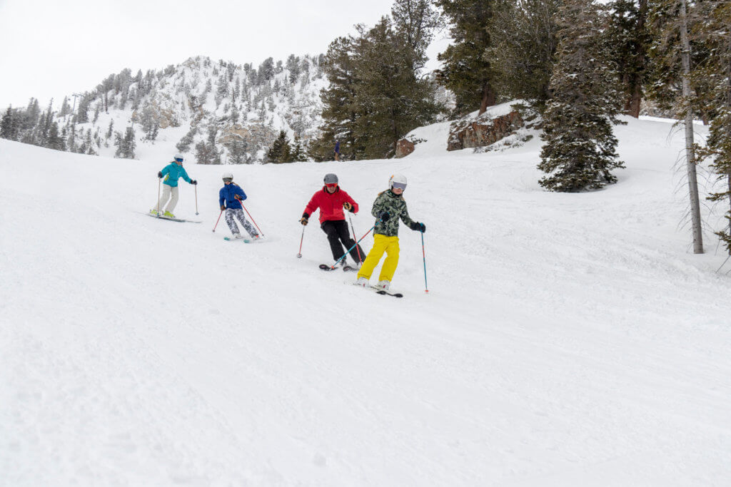 Family learning to ski and snowboard together at Solitude Mountain Resort
